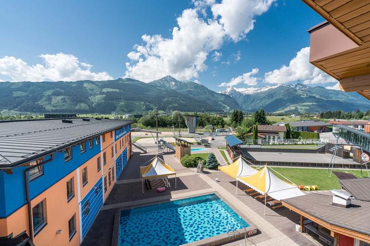 The Kitzsteinhorn Klub's outdoor pool with mountain views