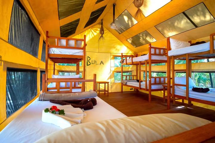 Bunk beds inside a permanent tent on Barefoot Manta Island