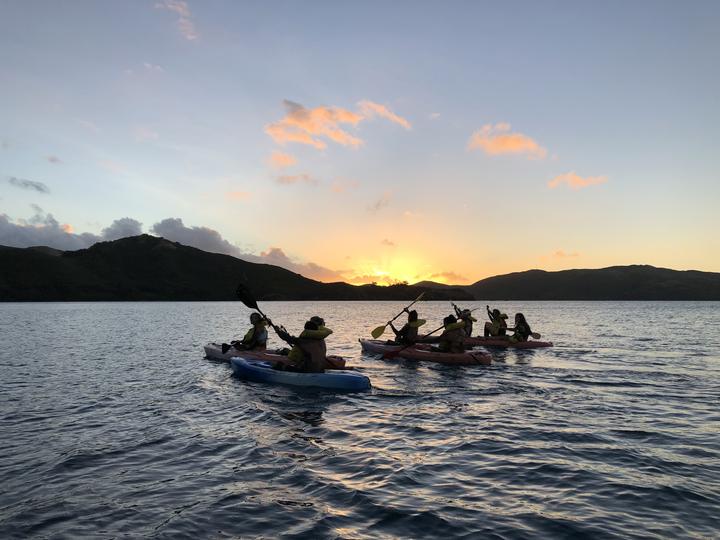 Kayaking at sunset off the Fijian coast