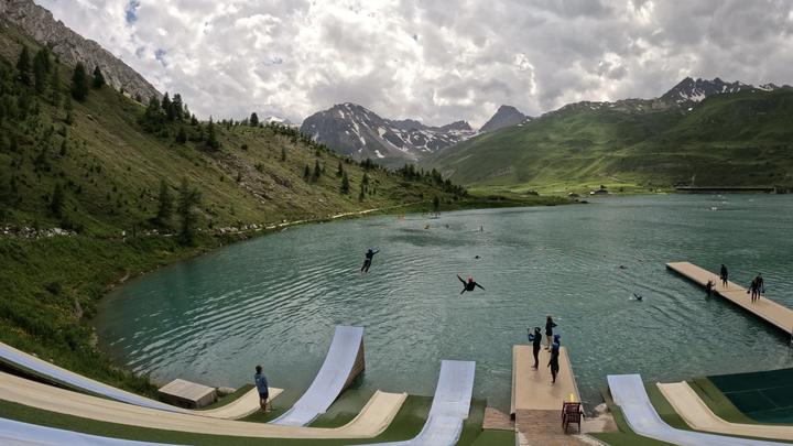Water-jump ramps sliding into a mountain lake in the Alps