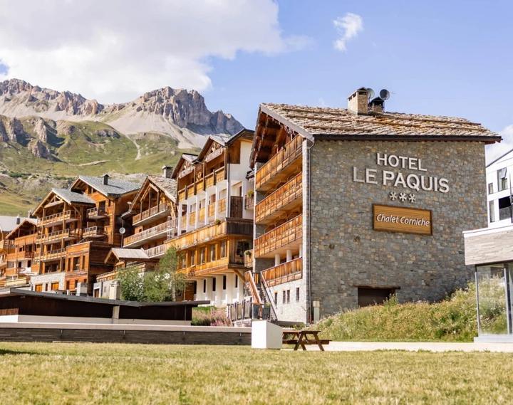 Chalet-style hotel in Tignes with the mountains behind