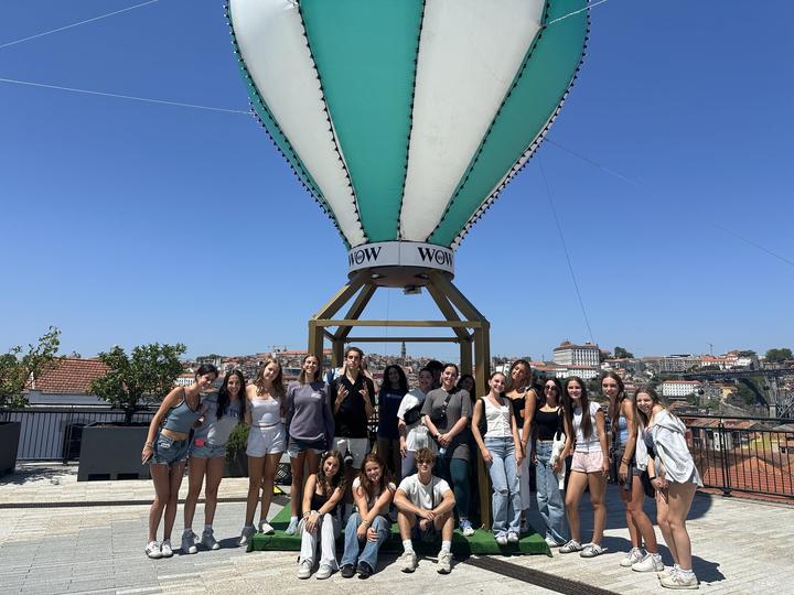 The group under a giant hot-air balloon sculpture in Porto