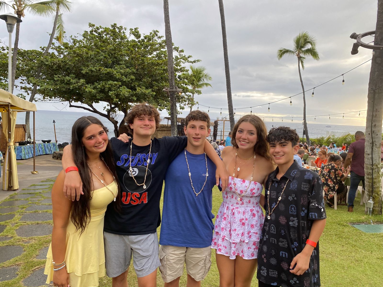 Teens in leis at a luau in Kona