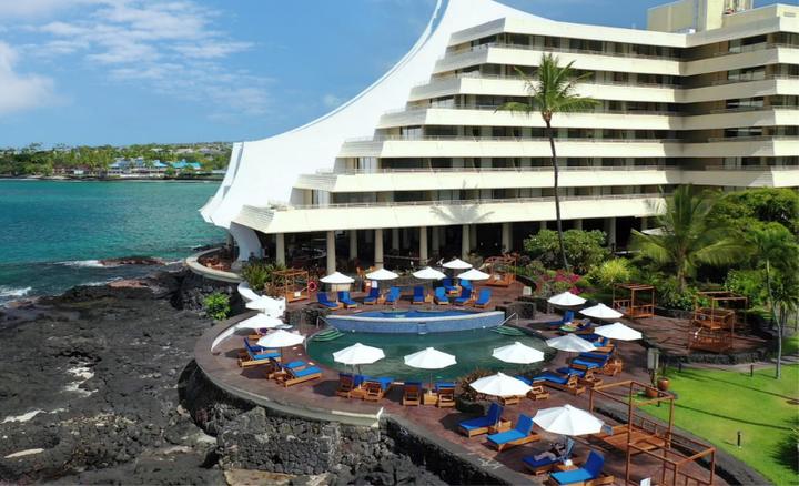Resort hotel with a pool on the lava shore in Kona
