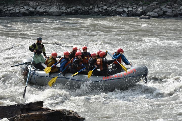 Teens whitewater rafting in Alaska