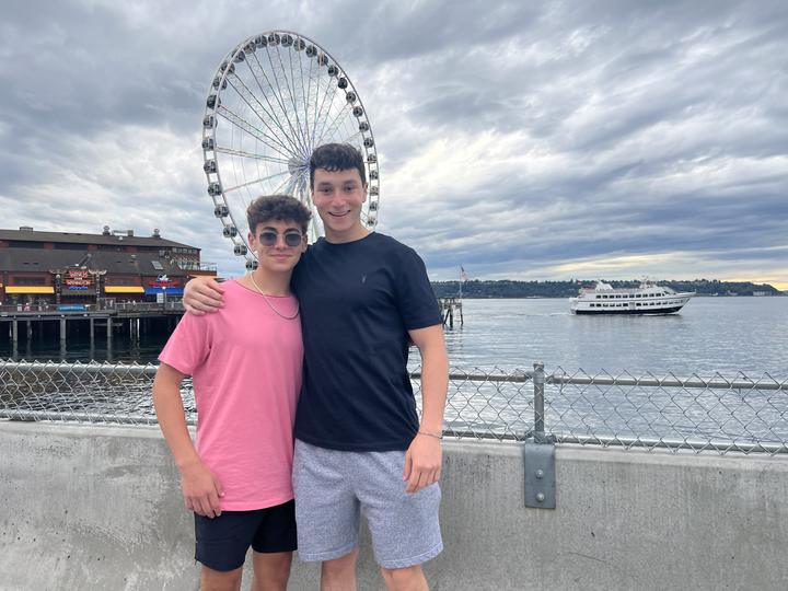 Two boys on the Seattle waterfront by the Great Wheel
