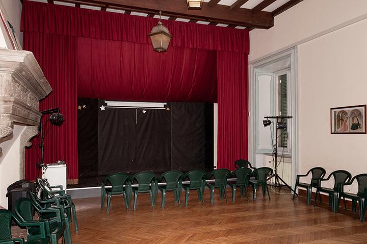 The school theatre with its red curtain