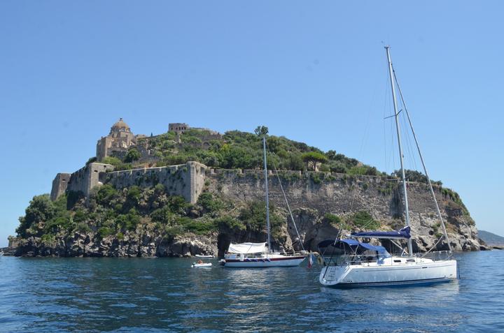 Yachts anchored below the Aragonese Castle on Ischia
