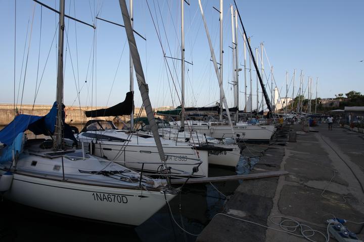 Sailing yachts moored side by side in the marina