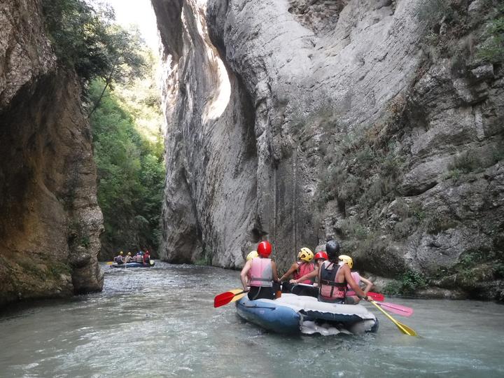 A raft between the rock walls of a river gorge