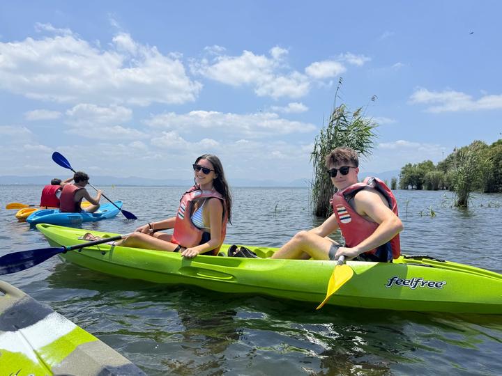 Teens kayaking on a lake in Japan