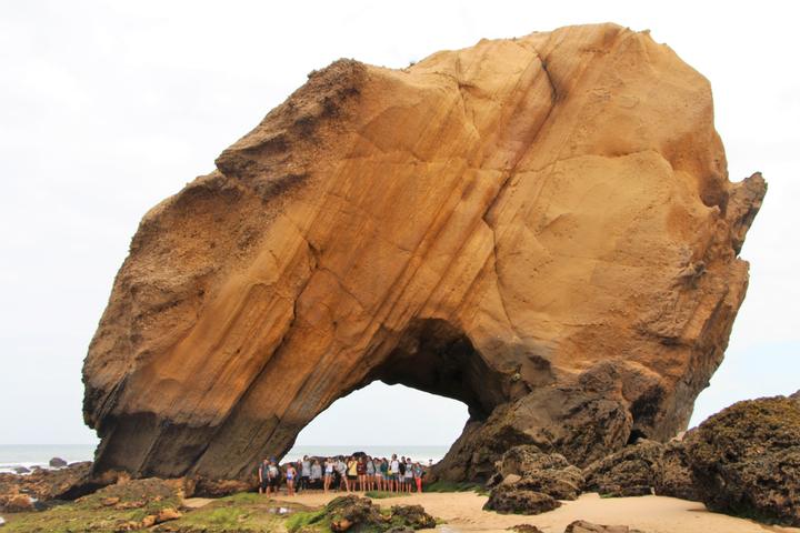 Natural sandstone rock arch on the beach near Santa Cruz