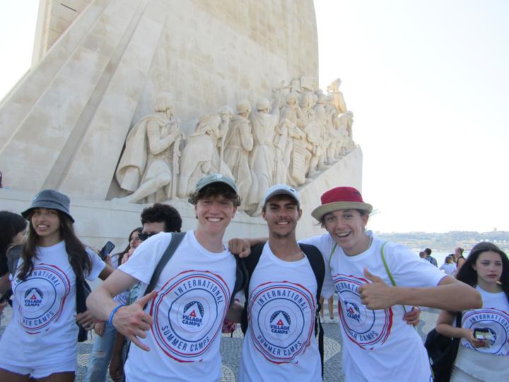 Campers in camp T-shirts at the Monument to the Discoveries in Lisbon