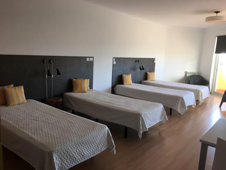 Bright bedroom with single beds in the camp residence