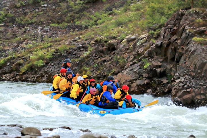 Rafting through a rocky canyon in Iceland