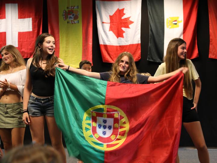 Campers presenting the Portuguese flag at International Night