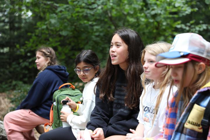 Campers listening during an outdoor session