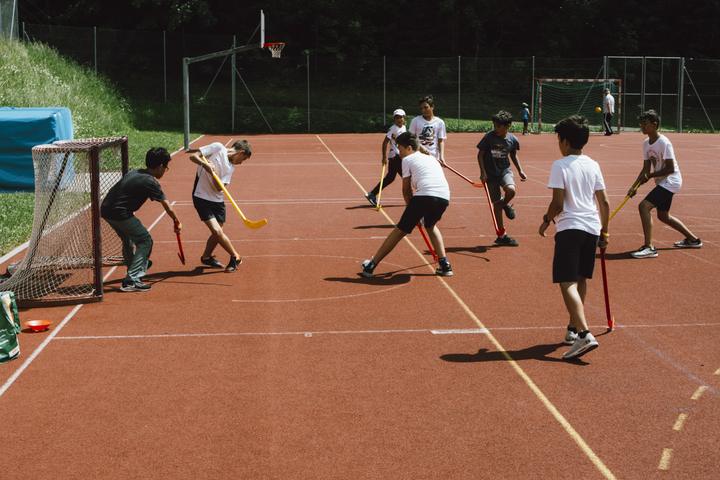 Street hockey on an outdoor court