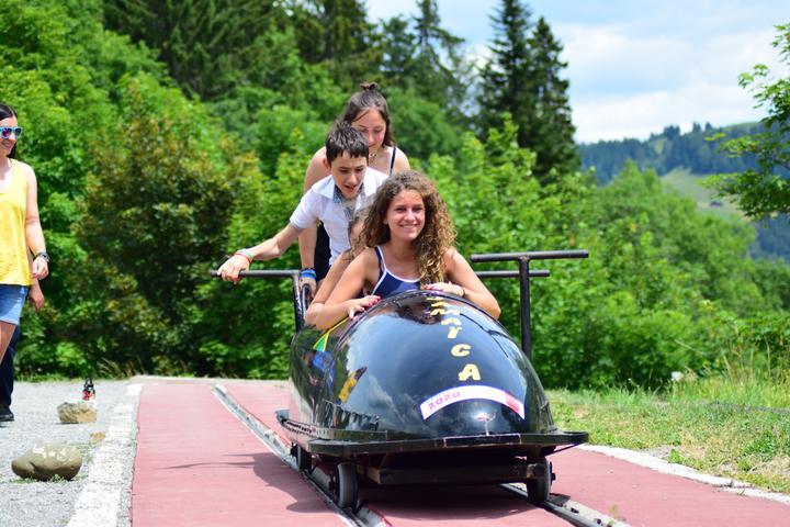Campers riding the summer bobsled track