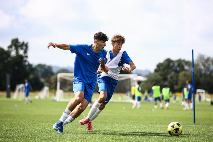 Two players battling for the ball in a training game