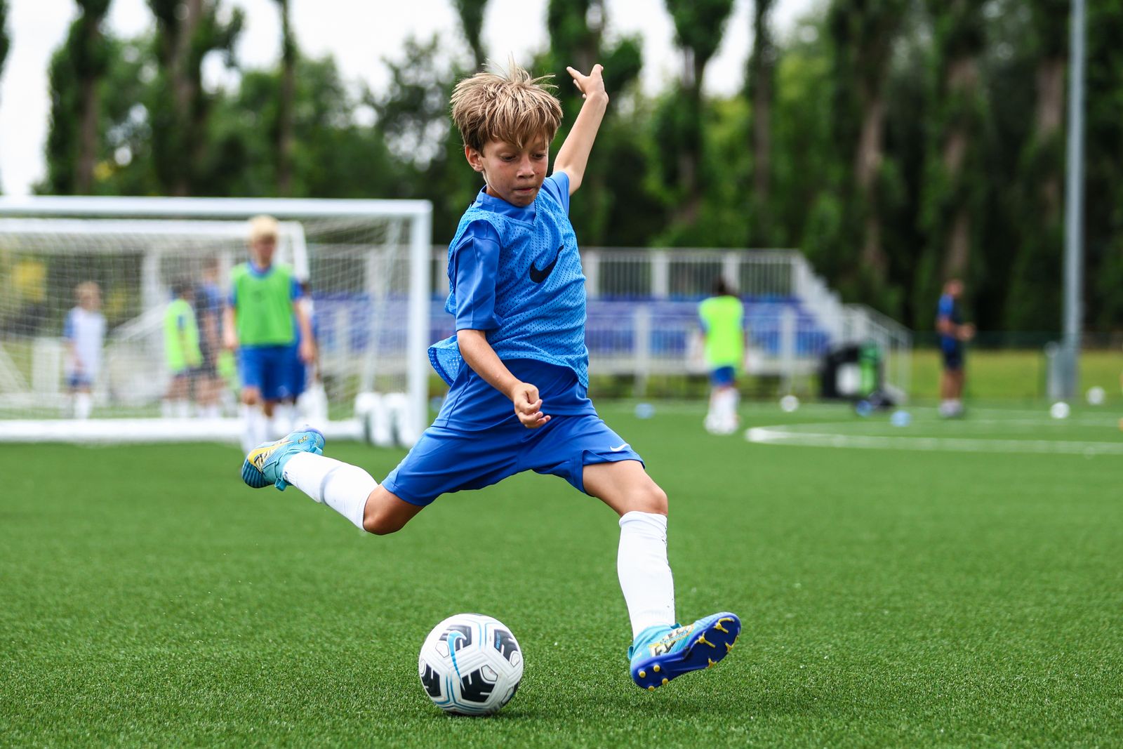 A young player striking the ball during a Chelsea FC session