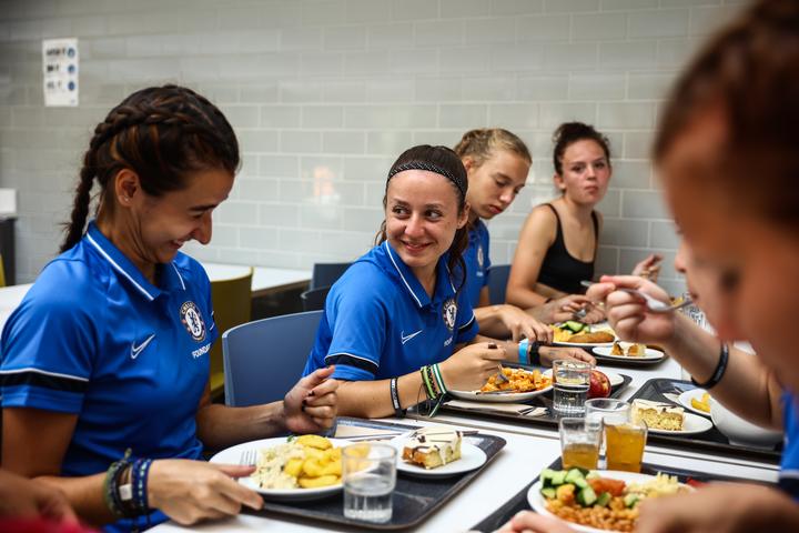 Girls laughing together over dinner