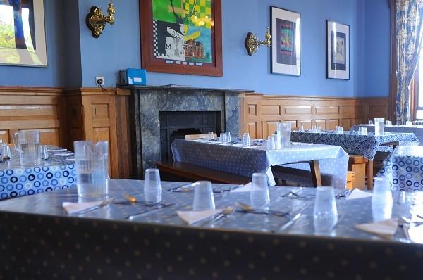 One of the school's dining rooms, with the tables laid