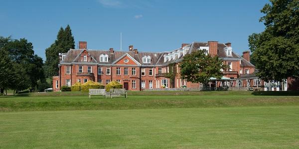 The school's historic main building, where students live, seen across the lawn