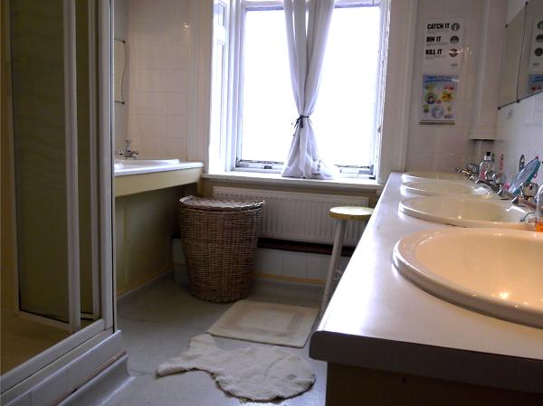 A girls' bathroom in the boarding house, with washbasins and a shower