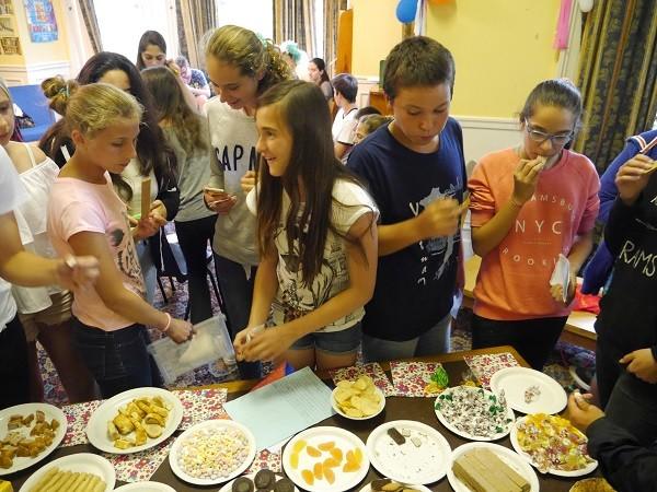 Students trying snacks from different countries