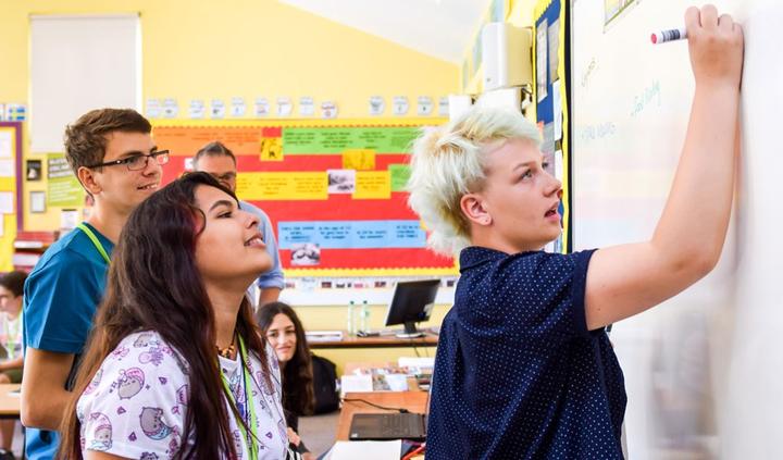 Students at the whiteboard during an English lesson