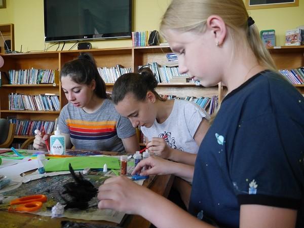 Students making masks in an arts and crafts session