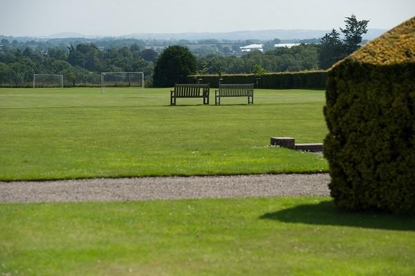 Benches on the school grounds, looking out over the countryside