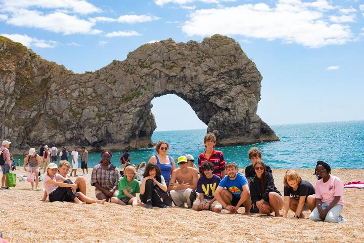 Group photo on the beach in front of Durdle Door