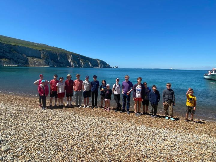 Group on a shingle beach on the south coast