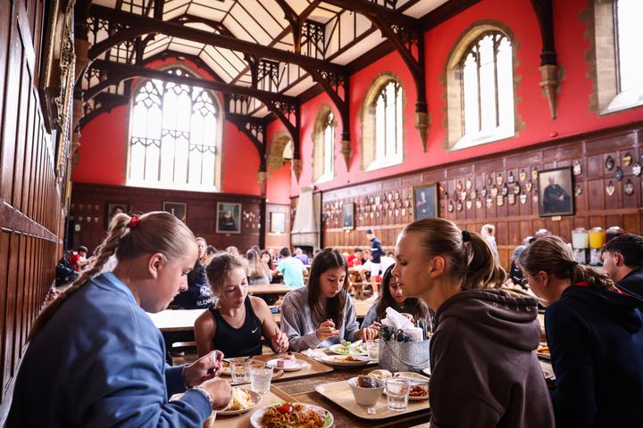 Campers eating in Radley's wood-panelled dining hall