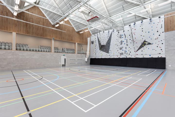 Winchester College's eight-court sports hall with its climbing wall