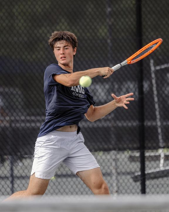 A boy hitting a forehand