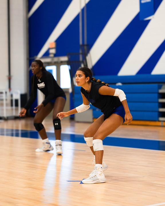 Two girls ready in defence, waiting for the serve
