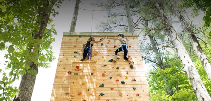 Campers on the outdoor climbing wall