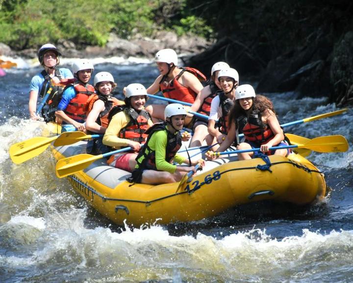 Campers whitewater rafting on a wilderness trip