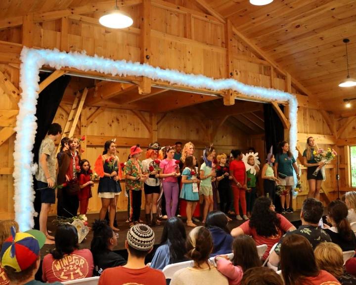 Campers performing a show on the wooden stage