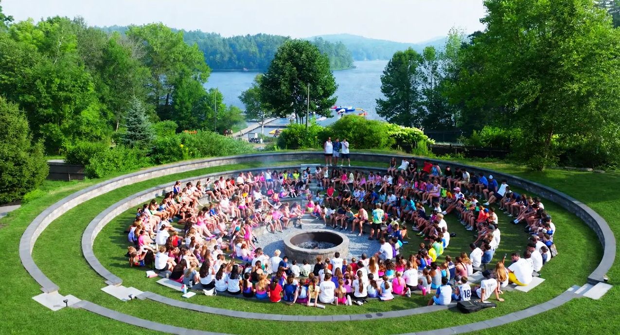 Whole camp gathered in the lakeside campfire amphitheatre