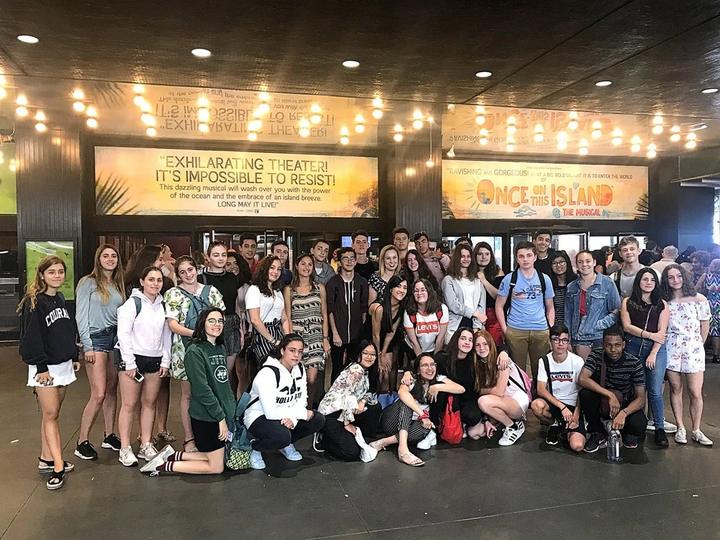 The whole camp in a Broadway theatre lobby before a musical