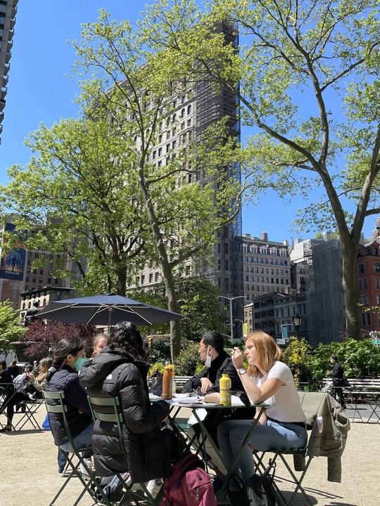 Class at a café table near the Flatiron Building
