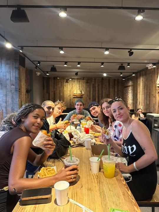 Young adults sharing dinner at a restaurant