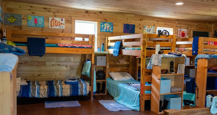 Air-conditioned bunk with wooden beds and cubbies