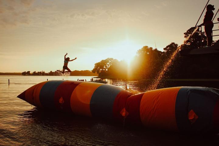 Camper launched from the water blob at sunset on the lake