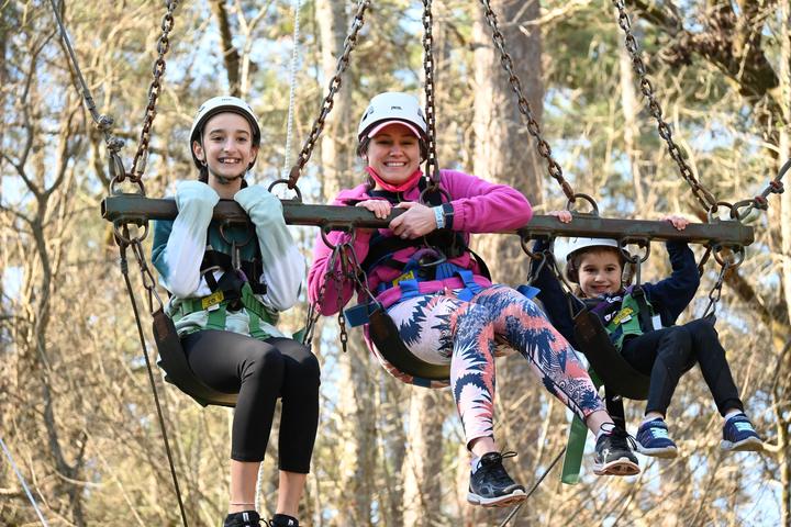 Campers riding the giant swing on the challenge course