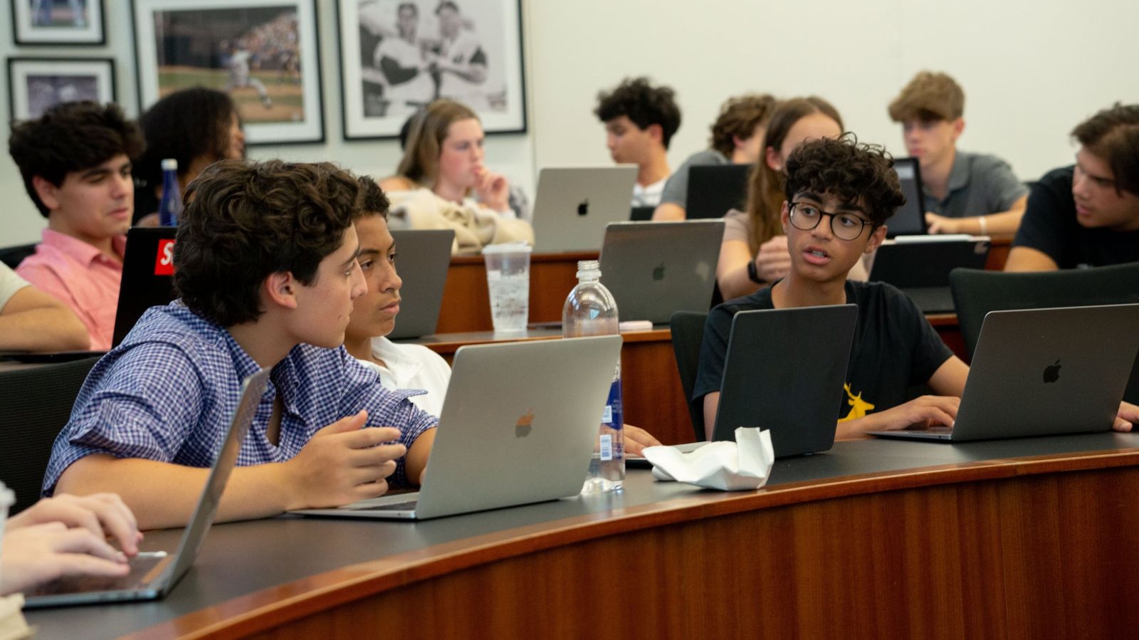 Students at laptops in a lecture room